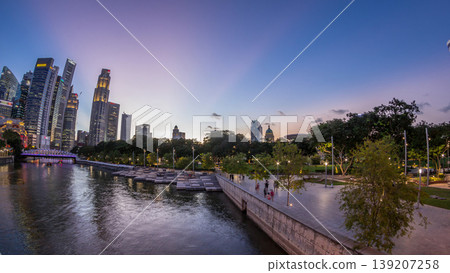 Singapore skyscrapers skyline with white Anderson Bridge near esplanade park day to night timelapse. Singapore skyscrapers skyline with white Anderson Bridge near esplanade park day to night timelapse. 139207258