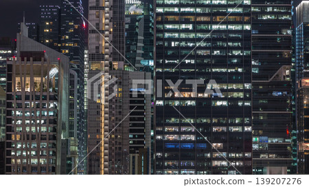 Aerial cityscape of Singapore downtown of modern architecture with skyscrapers night timelapse Aerial cityscape of Singapore downtown of modern architecture with skyscrapers night timelapse 139207276