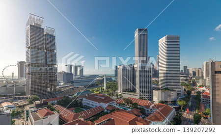 A beautiful morning panorama with Marina Bay area and skyscrapers city skyline aerial timelapse. 139207292