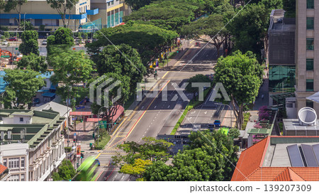 Traffic with cars on a street and urban scene in the central district of Singapore timelapse Traffic with cars on a street and urban scene in the central district of Singapore timelapse 139207309