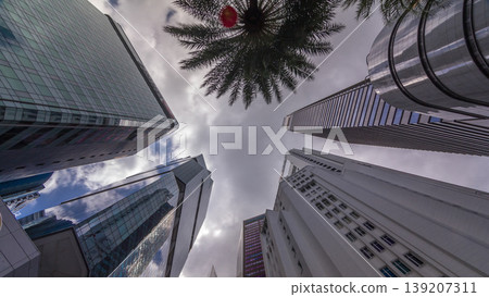 Looking up perspective of modern business skyscrapers glass and sky view landscape of commercial building in central city timelapse Looking up perspective of modern business skyscrapers glass and sky view landscape of commercial building in central city timelapse 139207311