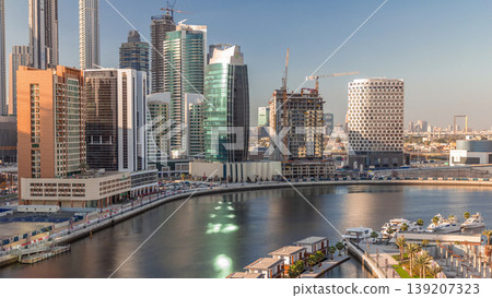 Skyscrapers near canal in Dubai with blue sky aerial timelapse 139207323