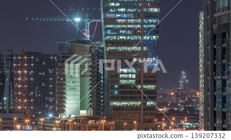 Beautiful lights in Dubai with constructing aerial timelapse Beautiful lights in Dubai with constructing aerial timelapse 139207332