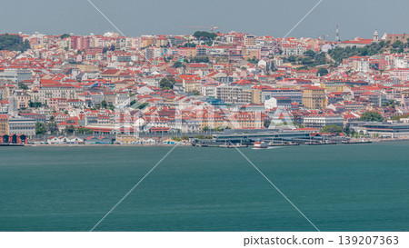 Panorama of Lisbon historical centre aerial timelapse viewed from above the southern margin of the Tagus or Tejo River. Panorama of Lisbon historical centre aerial timelapse viewed from above the southern margin of the Tagus or Tejo River. 139207363