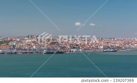 Panorama of Lisbon historical centre aerial timelapse viewed from above the southern margin of the Tagus or Tejo River. Panorama of Lisbon historical centre aerial timelapse viewed from above the southern margin of the Tagus or Tejo River. 139207369
