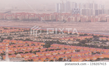 Aerial view of apartment houses and villas in Dubai city timelapse, United Arab Emirates Aerial view of apartment houses and villas in Dubai city timelapse, United Arab Emirates 139207415