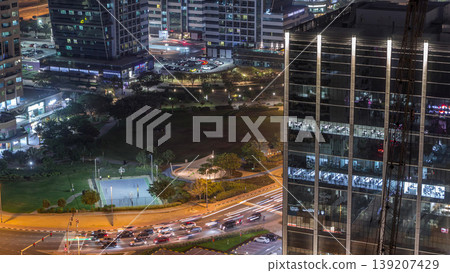 Residential and office buildings in Jumeirah lake towers district night timelapse in Dubai Residential and office buildings in Jumeirah lake towers district night timelapse in Dubai 139207429