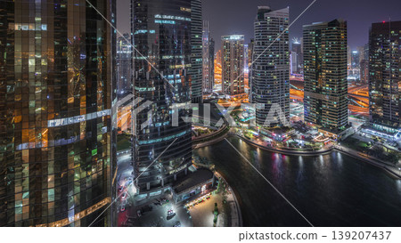 Residential and office buildings in Jumeirah lake towers district night timelapse in Dubai Residential and office buildings in Jumeirah lake towers district night timelapse in Dubai 139207437