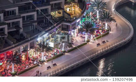 Waterfront promenade in Dubai Marina aerial night timelapse. Dubai, United Arab Emirates 139207496