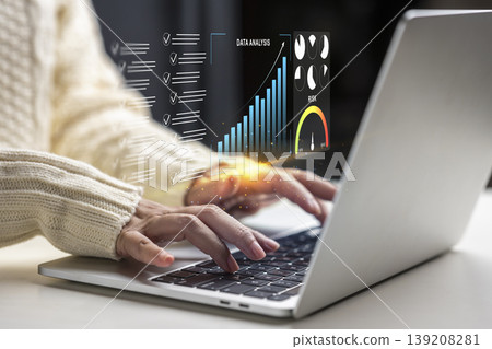 A person types on a laptop with a holographic data analysis overlay showing bar charts and metrics, illustrating modern business intelligence, statistics, and technological progress A person types on a laptop with a holographic data analysis overlay showing bar charts and metrics, illustrating modern business intelligence, statistics, and technological progress 139208281