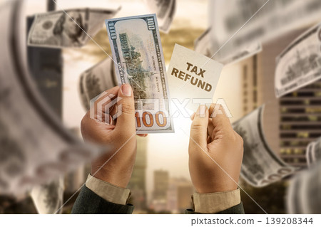 A person holds a hundred dollar bill and a tax refund card against a blurred city background with falling money, symbolizing financial returns and government rebates 139208344