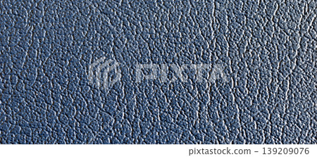 A turquoise faux leather fabric texture macro close up 139209076