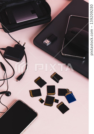 A freelancer's desktop tech gadget set vertical view A freelancer's desktop tech gadget set vertical view 139209280