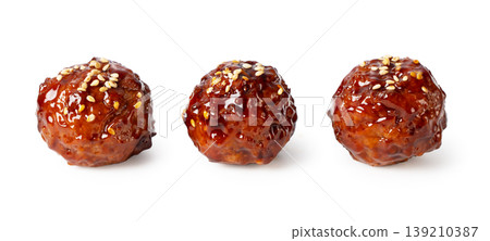 White background with three meatballs in sweet and sour sauce (cutout material) 139210387