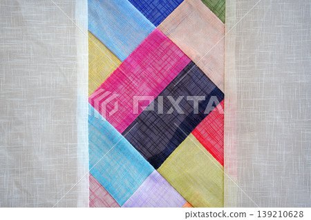 Korean traditional patchwork Jogakbo texture, colorful ramie fabric scraps hand-sewn for abstract geometric background, oriental heritage textile art. Korean traditional patchwork Jogakbo texture, colorful ramie fabric scraps hand-sewn for abstract geometric background, oriental heritage textile art. 139210628