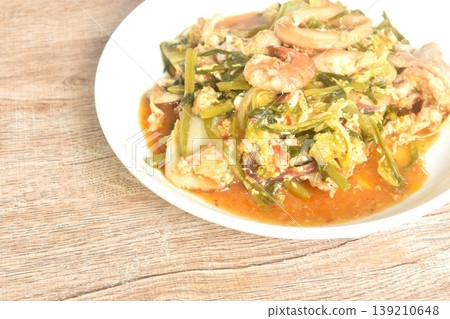 fried seafood with chicken and pork meat couple vegetable tooping egg yolk in sukiyaki sauce on plate fried seafood with chicken and pork meat couple vegetable tooping egg yolk in sukiyaki sauce on plate 139210648