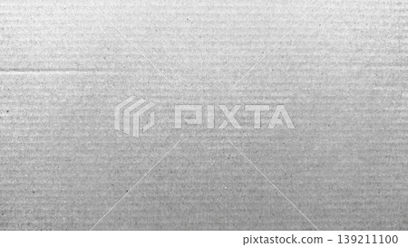 gray corrugated cardboard texture closeup highlighting horizontal ridges and subtle gradients for industrial minimalist background wallpaper or banner with copy space 139211100