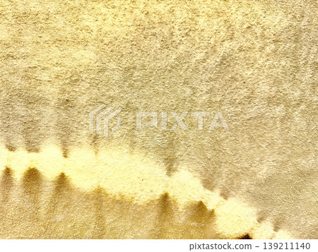 shimmering gold vinyl texture melting into soft wavy patterns on luxurious foil surface with blank copy space for premium wallpapers and elegant banners shimmering gold vinyl texture melting into soft wavy patterns on luxurious foil surface with blank copy space for premium wallpapers and elegant banners 139211140