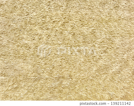 soft golden terrycloth texture closeup showcasing looped fibers and warm hues for luxury spa background or serene wallpaper soft golden terrycloth texture closeup showcasing looped fibers and warm hues for luxury spa background or serene wallpaper 139211142