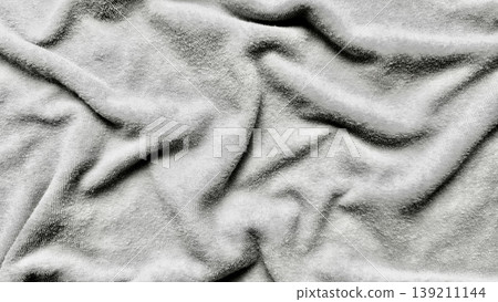 monochrome soft fabric folds rippling elegantly in grayscale texture for minimalist wallpaper or serene banner background monochrome soft fabric folds rippling elegantly in grayscale texture for minimalist wallpaper or serene banner background 139211144