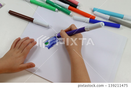 child's hands draw with the brush child's hands draw with the brush 139211475