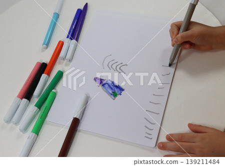 child's hands draw with the brush child's hands draw with the brush 139211484