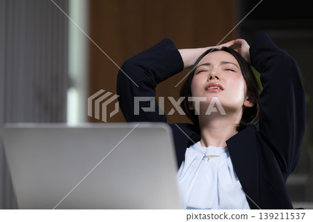 I'm so tired of working overtime! A busy woman struggling to finish her work – the business world: Issues of job changes, stress, and work-related problems. I'm so tired of working overtime! A busy woman struggling to finish her work – the business world: Issues of job changes, stress, and work-related problems. 139211537