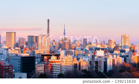 A cityscape overlooking the Ichigaya area of Tokyo at dusk. A cityscape overlooking the Ichigaya area of Tokyo at dusk. 139211610