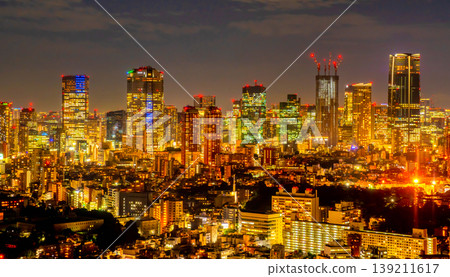 The night view of Tokyo's skyscrapers and towering high-rise buildings, bathed in dazzling light. 139211617