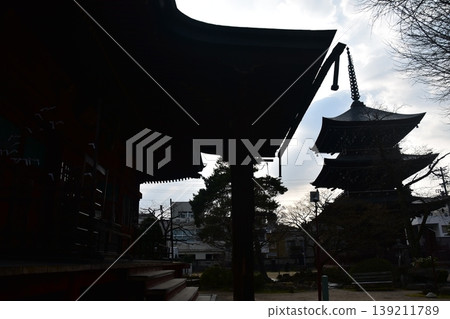 Takayama City, Gifu Prefecture, Japan - Hida Kokubunji Temple's three-story pagoda and surrounding townscape during the Takayama Spring Festival Takayama City, Gifu Prefecture, Japan - Hida Kokubunji Temple's three-story pagoda and surrounding townscape during the Takayama Spring Festival 139211789