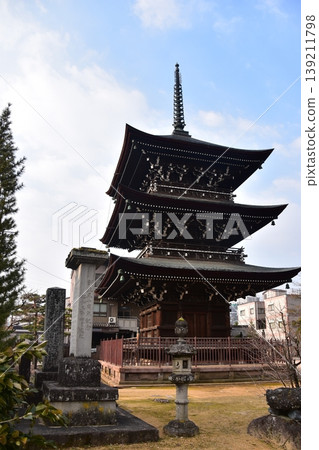 Takayama City, Gifu Prefecture, Japan - Hida Kokubunji Temple's three-story pagoda and surrounding townscape during the Takayama Spring Festival Takayama City, Gifu Prefecture, Japan - Hida Kokubunji Temple's three-story pagoda and surrounding townscape during the Takayama Spring Festival 139211798