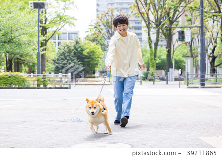 Lifestyle: A man walking his dog 139211865