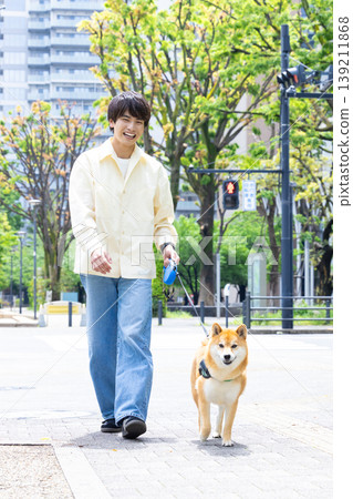 Lifestyle: A man walking his dog Lifestyle: A man walking his dog 139211868