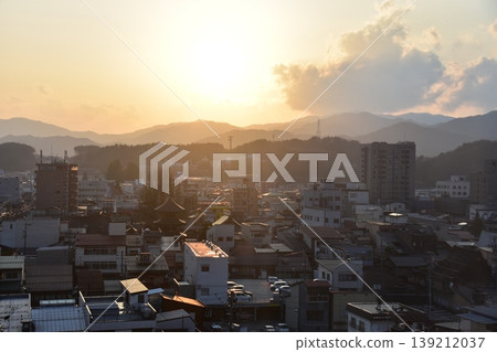Takayama City, Gifu Prefecture, Japan - Aerial view of the cityscape and beautiful sunset from a high-rise building, facing the three-story pagoda in the city center Takayama City, Gifu Prefecture, Japan - Aerial view of the cityscape and beautiful sunset from a high-rise building, facing the three-story pagoda in the city center 139212037