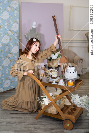 A young woman carrying a wagon A young woman carrying a wagon 139212292