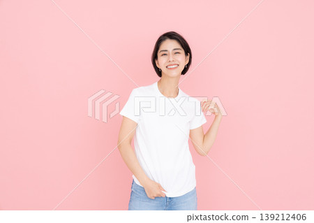 Young woman in a T-shirt Young woman in a T-shirt 139212406