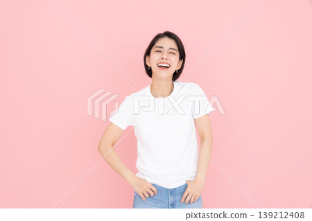 Young woman in a T-shirt Young woman in a T-shirt 139212408