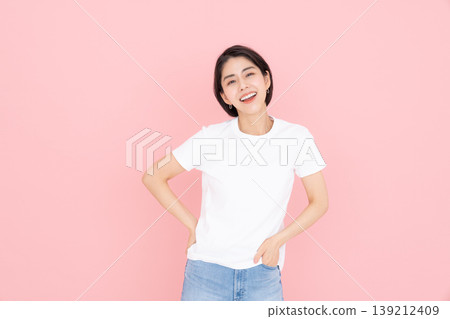 Young woman in a T-shirt Young woman in a T-shirt 139212409