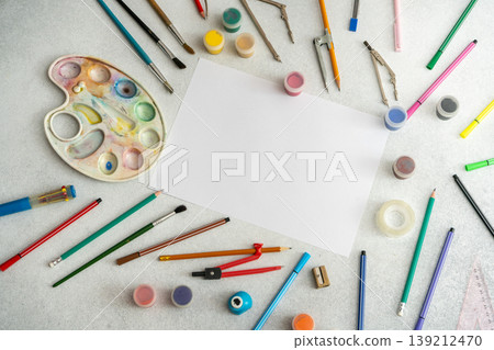 Creative Art Workspace with Blank Paper Watercolor Paints Pencils, Brushes Drawing Tools Top View Creative Art Workspace with Blank Paper Watercolor Paints Pencils, Brushes Drawing Tools Top View 139212470