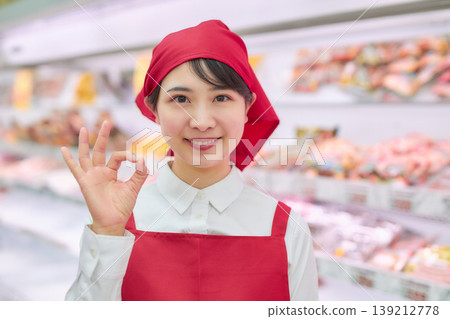 A young woman working at a supermarket's sample counter A young woman working at a supermarket's sample counter 139212778