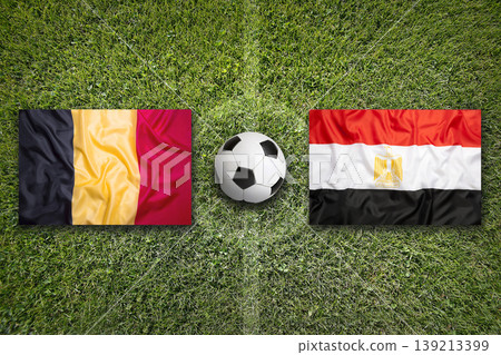 Belgium vs. Egypt flags on a soccer field 139213399