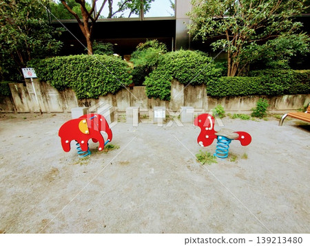 A scene with playground equipment in a park A scene with playground equipment in a park 139213480