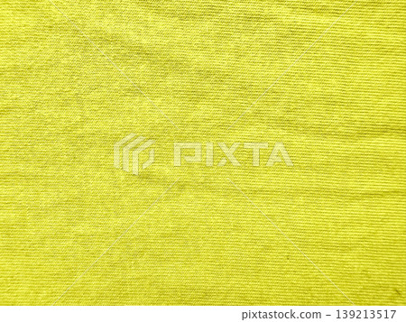 vibrant yellow corduroy fabric texture closeup showcasing fine parallel ridges and soft velvety surface in warm golden hues 139213517