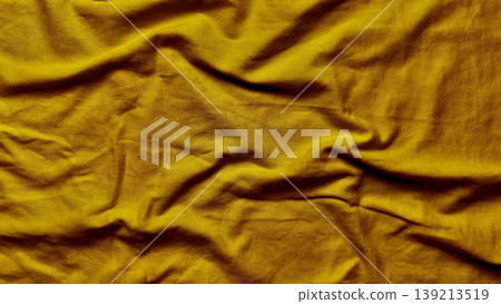 wrinkled golden fabric texture closeup luxurious shimmering folds elegant drape abstract background rich mustard tones undulating surface sophisticated material 139213519