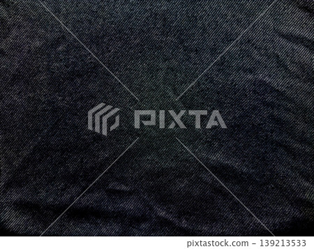 dark blue denim texture closeup intricate weave patterns subtle folds rugged fabric evoking industrial elegance fashion background 139213533
