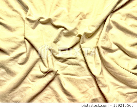 crumpled pale yellow cotton fabric texture closeup soft folds wrinkles serene minimalism background crumpled pale yellow cotton fabric texture closeup soft folds wrinkles serene minimalism background 139213563