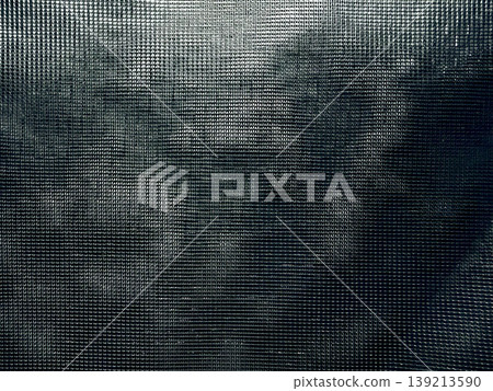 abstract dark mesh screen overlaying eerie foggy silhouette evoking mysterious nocturnal atmosphere in closeup texture abstract dark mesh screen overlaying eerie foggy silhouette evoking mysterious nocturnal atmosphere in closeup texture 139213590