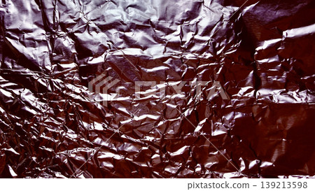 crumpled brown metallic foil texture closeup abstract background with shiny wrinkles and reflective folds evoking luxurious chocolate wrapper elegance crumpled brown metallic foil texture closeup abstract background with shiny wrinkles and reflective folds evoking luxurious chocolate wrapper elegance 139213598