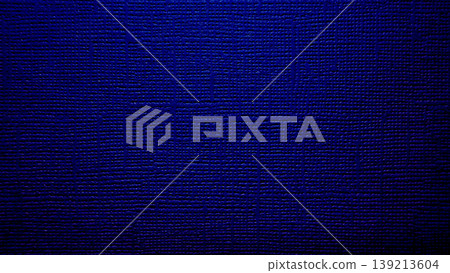 deep indigo blue woven fabric texture gleaming in closeup evoking midnight elegance and subtle sheen for design backdrops 139213604