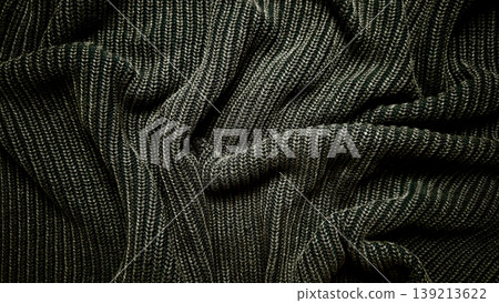 ribbed knit sweater texture closeup in dark olive green with soft flowing folds and cozy warmth ribbed knit sweater texture closeup in dark olive green with soft flowing folds and cozy warmth 139213622